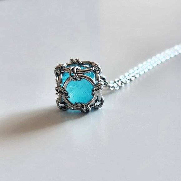 Aquamarine blue caged pearl necklace with a small silver chain - Picture 7 of 12